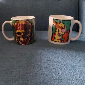 Two oversized Disney mugs.